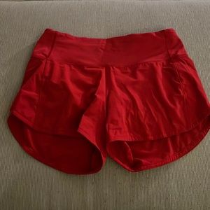 Gently worn Lululemon red Speed Up 2.5 inch shorts.